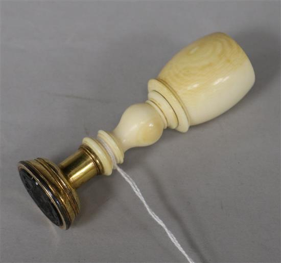 A 19th century baluster-turned ivory and gilt metal desk seal, L 9cm